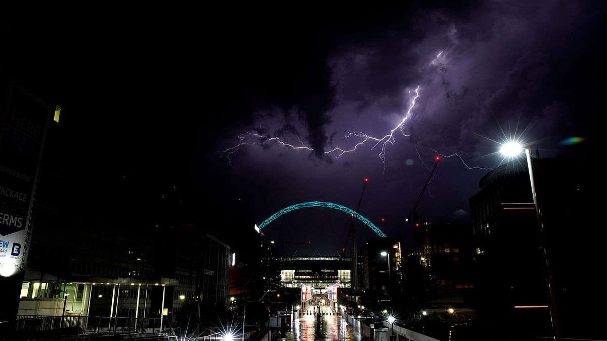 Lightning strikes above Wembley Stadium in London, Britain on 26 May 2018. Photo: Reuters