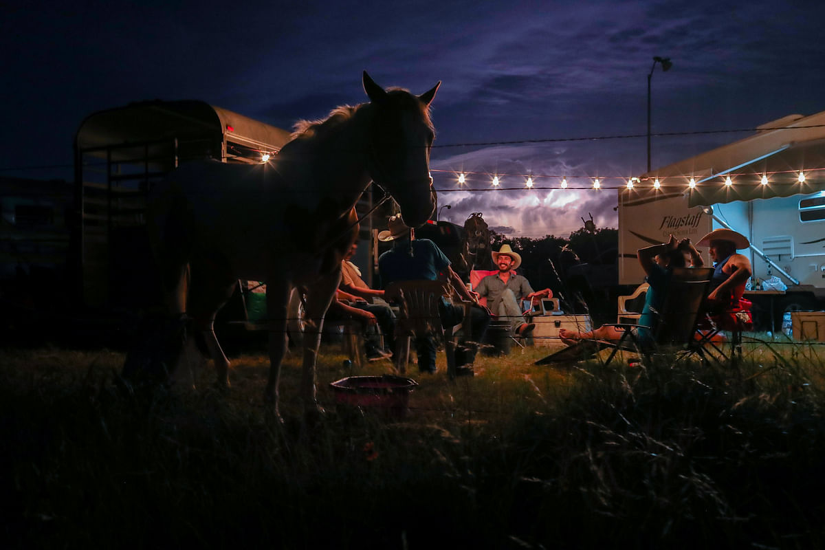 Lighting fills the sky as cowboys from the Rio Grande Valley set camp after arriving for Memorial Day weekend in Bandera, Texas, US on 25 May. Photo: Reuters