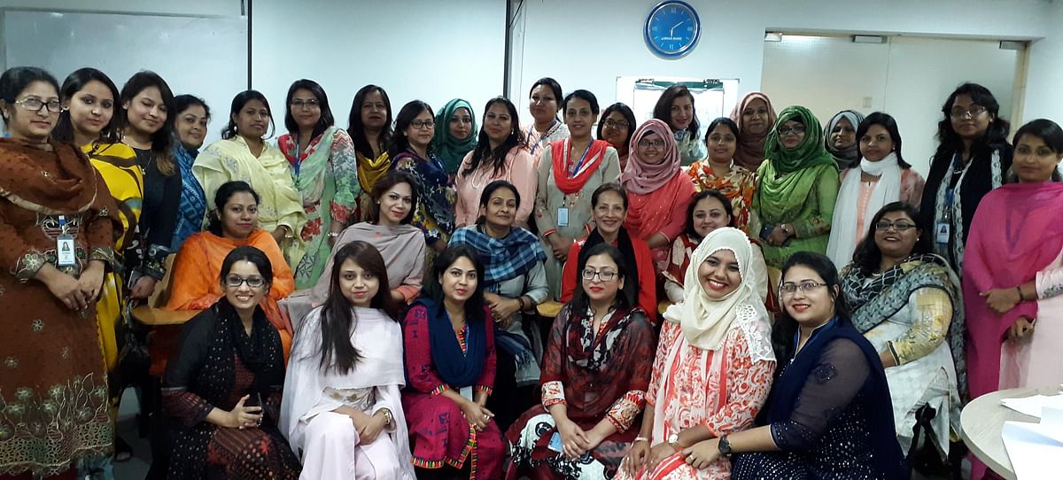 BRAC women employees pose with senior banker Nasreen Sattar at the end of leadership training programme