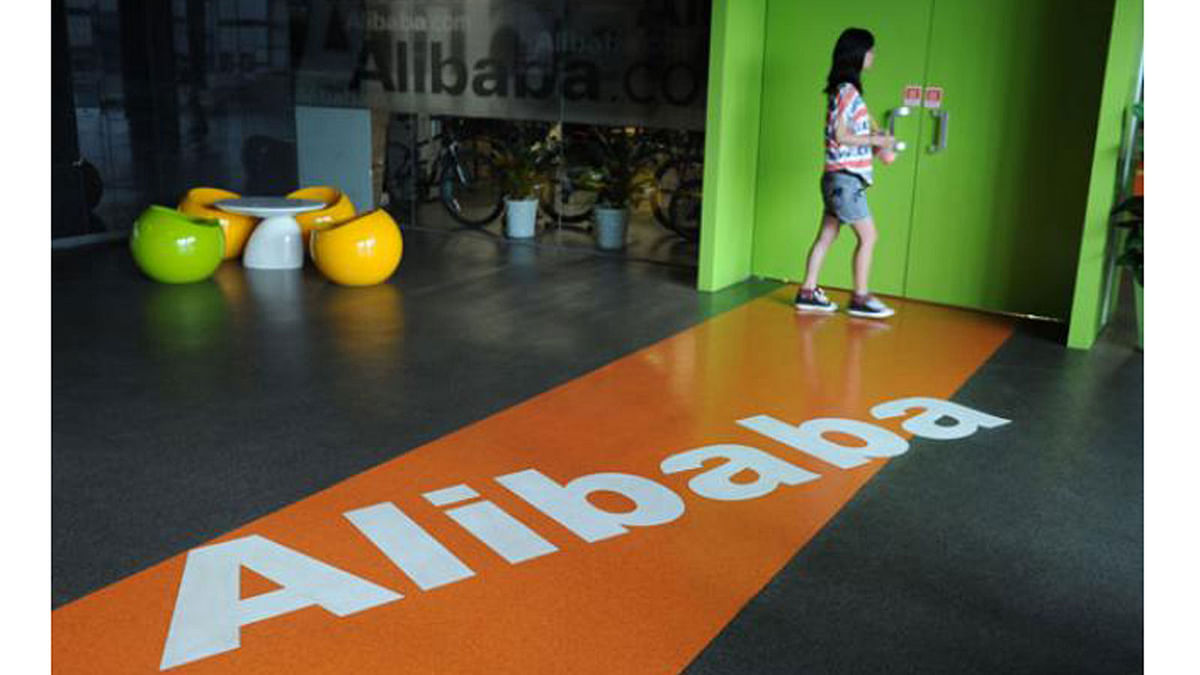 In this file photo taken on 20 June, 2012 an Alibaba employee walks through a communal space at the company`s headquarters in Hangzhou. Photo: AFP