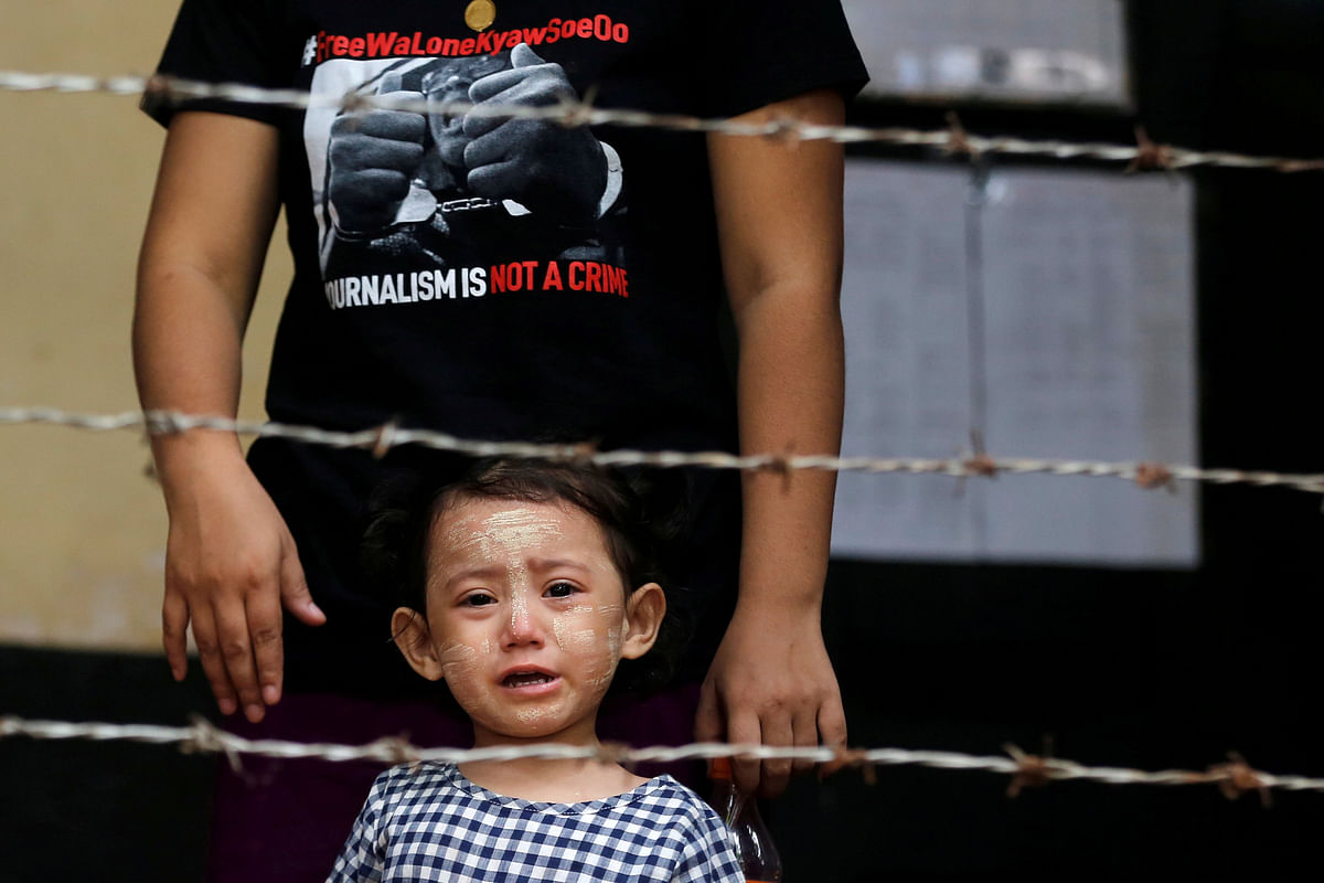 Detained Reuters journalist Kyaw Soe Oo`s daughter Moe Thin Wai Zin stands outside the court during a hearing in Yangon, Myanmar on 29 May 2018. Photo: Reuters