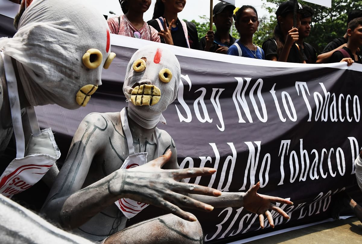 Indian anti-tobacco activists dressed as skeletons take part in an anti-tobacco awareness rally in Kolkata on May 31, 2018. May 31 is celebrated World No Tobacco Day to create awareness against tobacco consumption around the globe. AFP