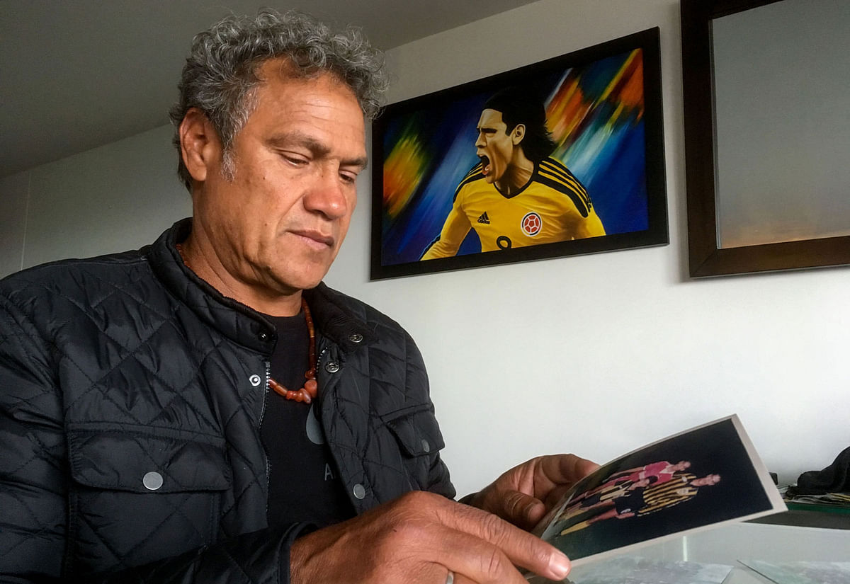 Radamel Garcia, father of Colombian national football team player Radamel Falcao, shows pictures of his son. Photo: AFP