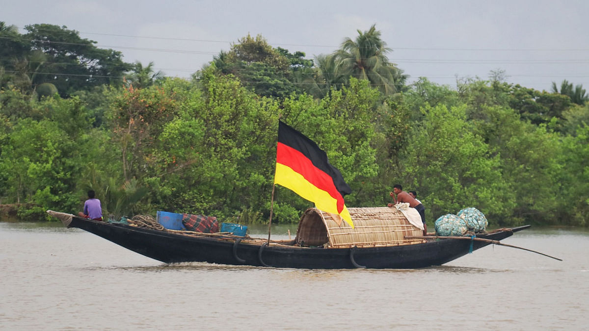 A 31 May photo shows a fishing boat hoisting Germany flag ahead of FIFA world cup 2018 in Telkhali of Dumuria upazila in Khulna. Photo: Saddam Hossain