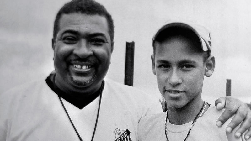 Reproduction of a picture of Brazilian coach Betinho and football player Neymar in the Associacao Atletica Ferroviaria, where the now Paris Saint German player started his career. AFP