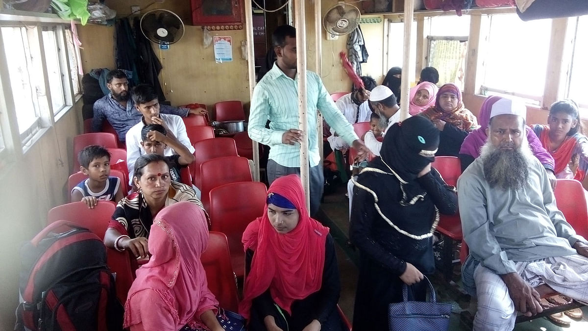 Passengers inside a waterbus ready to start the journey from Gabtoli to Badamtoli at Gabtoli landing station on Monday 28 May, 2018. Photo : Mushfique Wadud