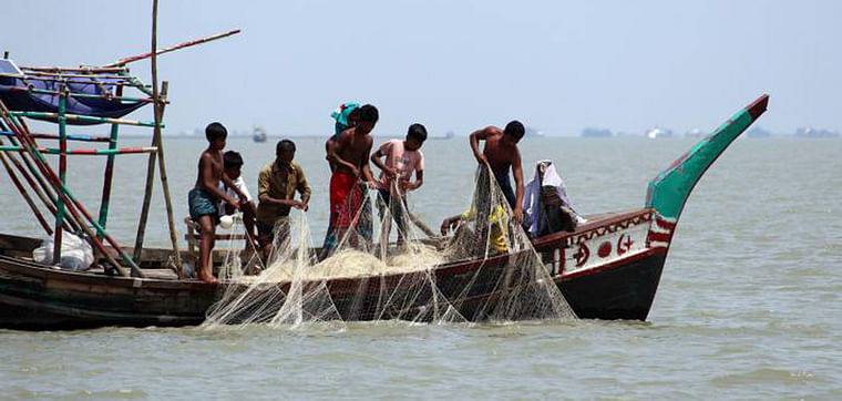 Fishermen cast their net for hilsa in Meghna river in Madanpur, Daulatkhan, Bhola on 27 May. 