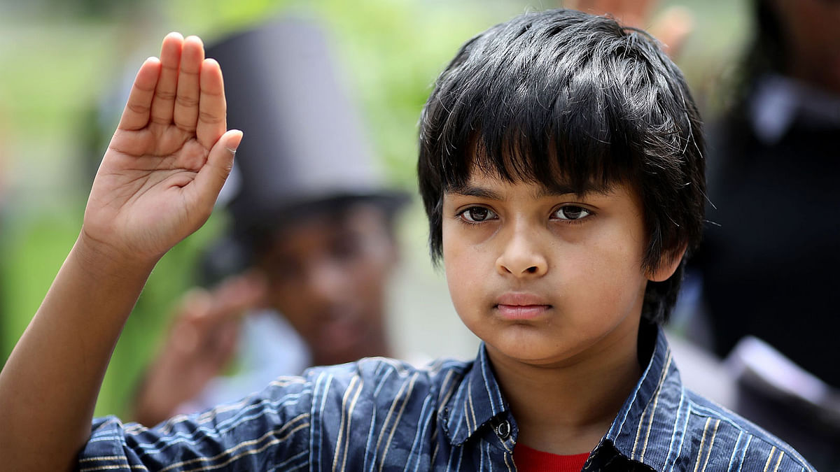 Children including from Bangladesh take the Oath of Citizenship during a children`s citizenship ceremony hosted by US Citizenship and Immigration Services on 31 May 2018 in Washington, DC. Photo: AFP