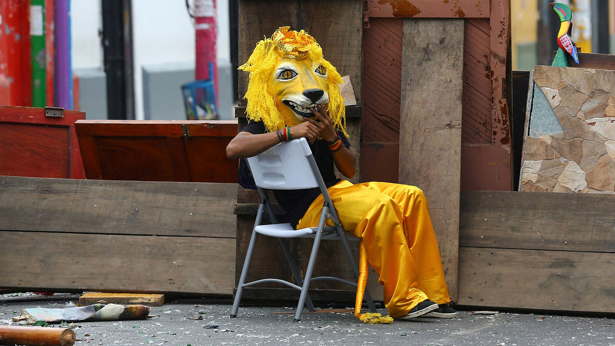 A demonstrator dressed as a lion sits behind a barricade during clashes with riot police during a protest against Nicaragua`s president Daniel Ortega`s government in Masaya, Nicaragua on 30 may. Photo: Reuters