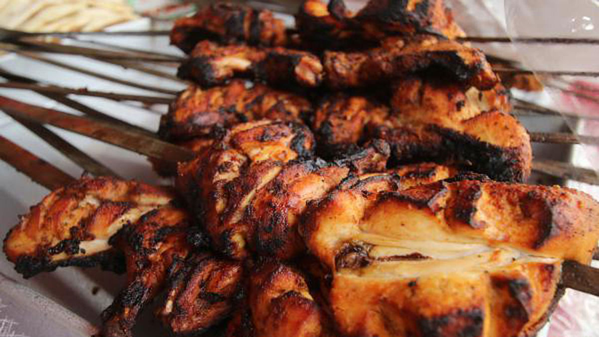 Many prefer the grilled chicken in Iftar shopping. Each of the grilled chicken is sold at taka 215. Dhanmondi, Dhaka, 21 May. Photo: Abdus Salam