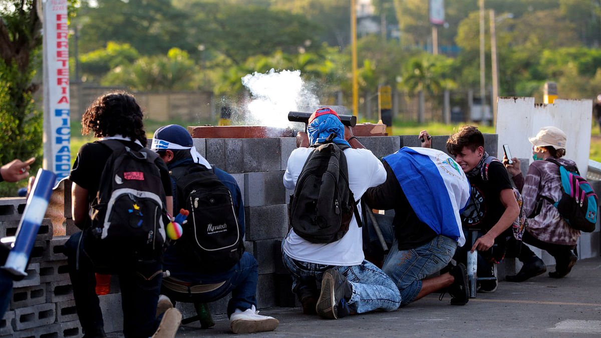 Demonstrators fire a homemade mortar during a protest against Nicaragua`s president Daniel Ortega`s government in Managua, Nicaragua on 30 may. Photo: Reuters