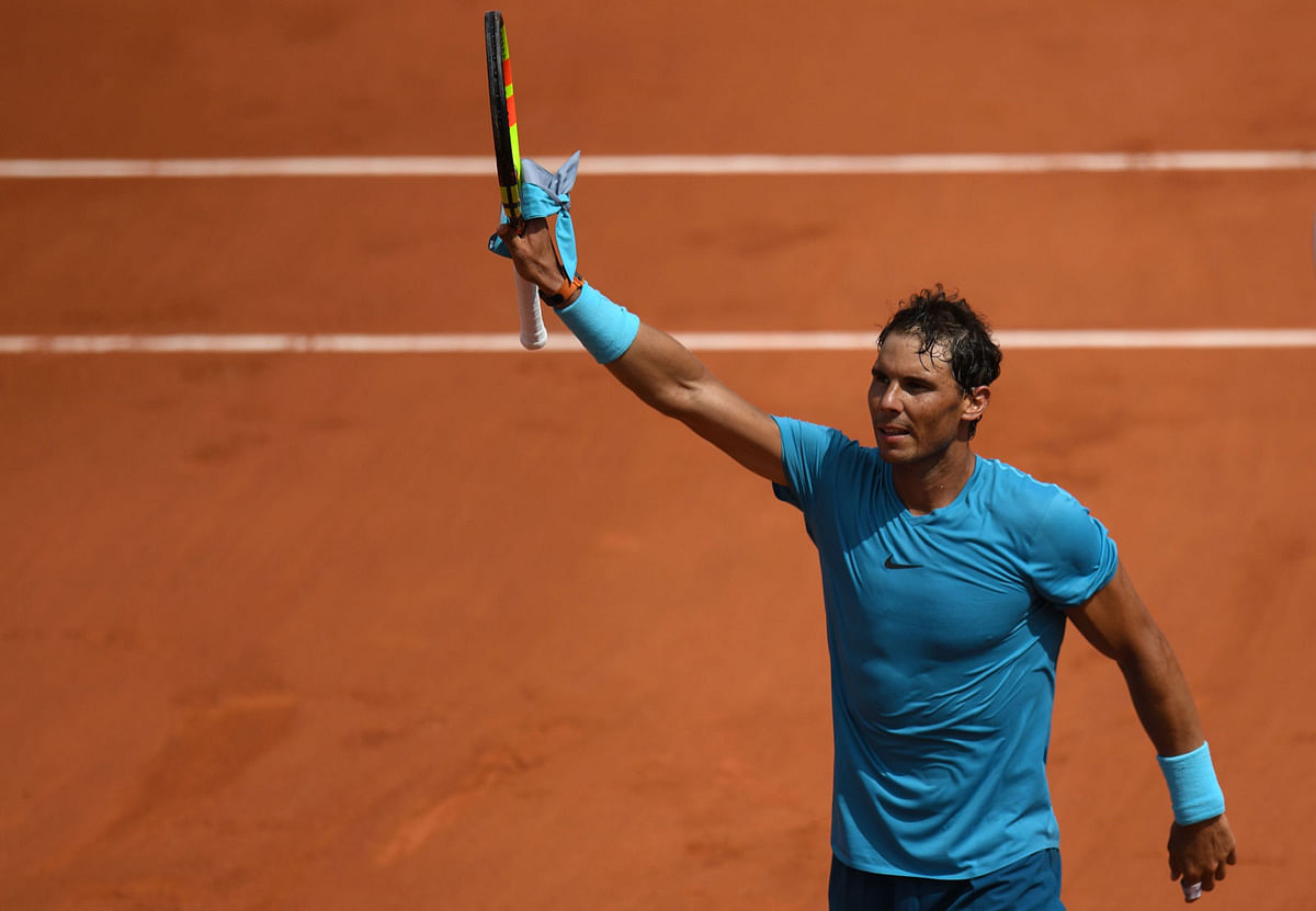 Spain`s Rafael Nadal celebrates after victory over Germany`s Maximilian Marterer at the end of their men`s singles fourth round match on day nine of The Roland Garros 2018 French Open tennis tournament in Paris on 4 June. Photo: AFP