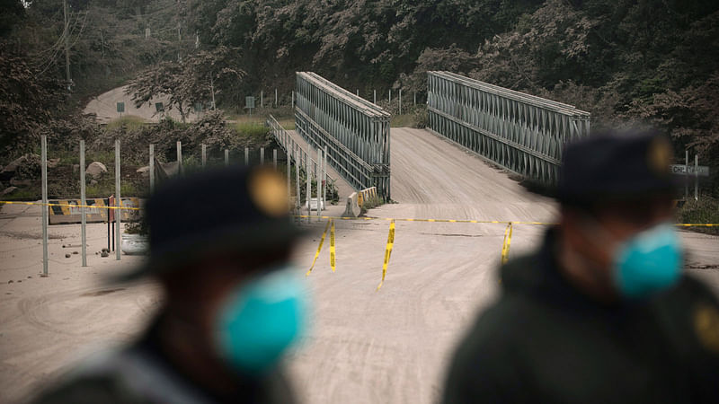 Police block a route affected by the ash expelled by Volcan de Fuego, or Volcano of Fire, in El Rodeo, Guatemala, Sunday on 3 June 2018. Photo: AP