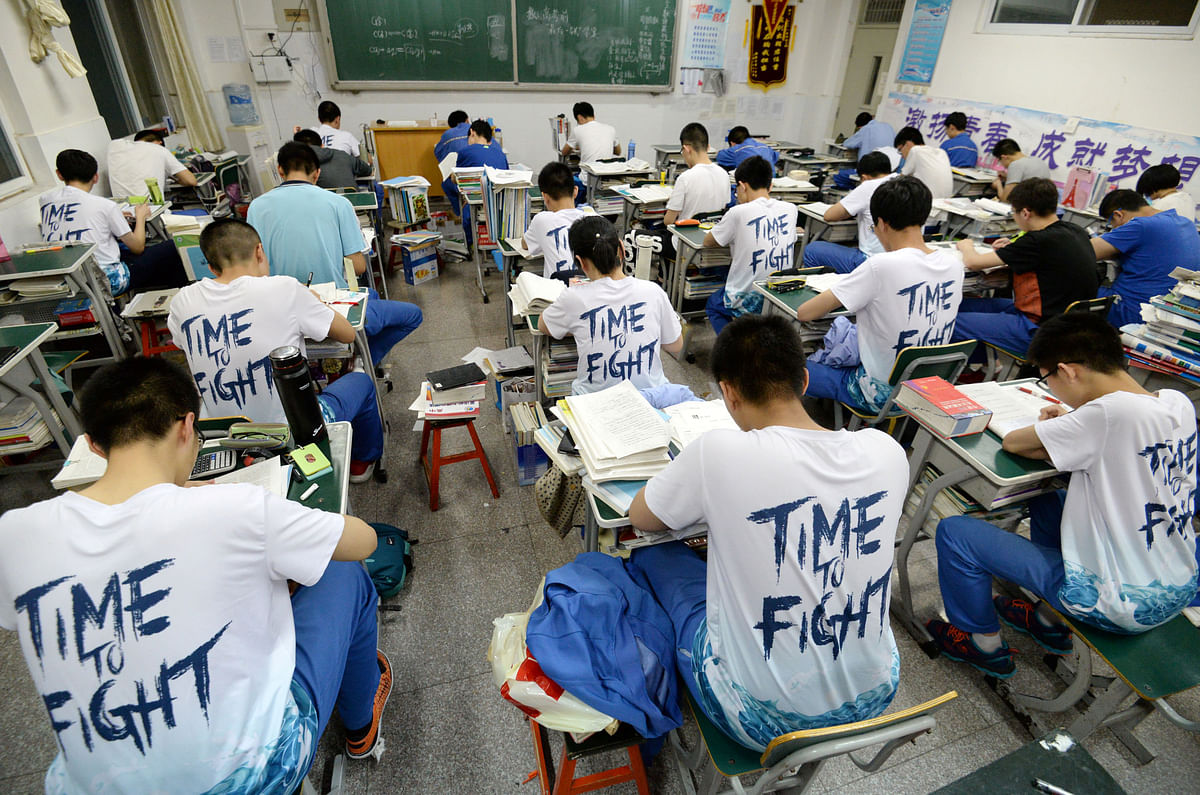 Students study in the evening ahead of the annual national college entrance examination, or `gaokao`, at a high school in Handan, Hebei province, China on 23 May. Photo: Reuters