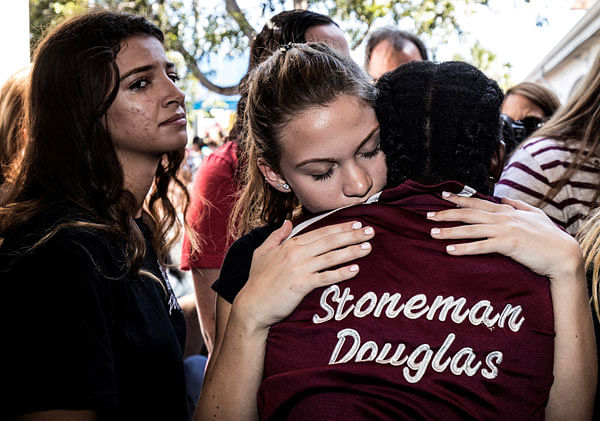 Students from Marjory Stoneman Douglas High School attend a memorial following a school shooting incident in Parkland, Florida, US, 15 February 2018. Photo: Reuters