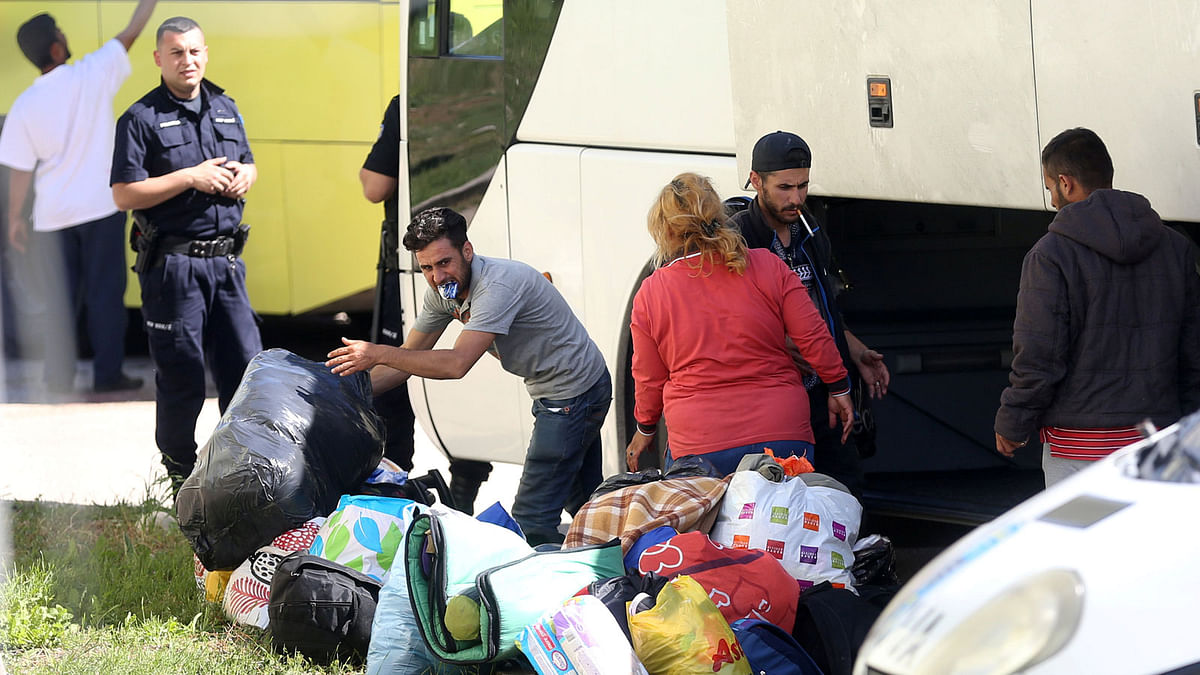 Migrants leave a bus at a camp in Salakovac, near Mostar, Bosnia and Herzegovina on 18 May 2018. Photo: Reuters