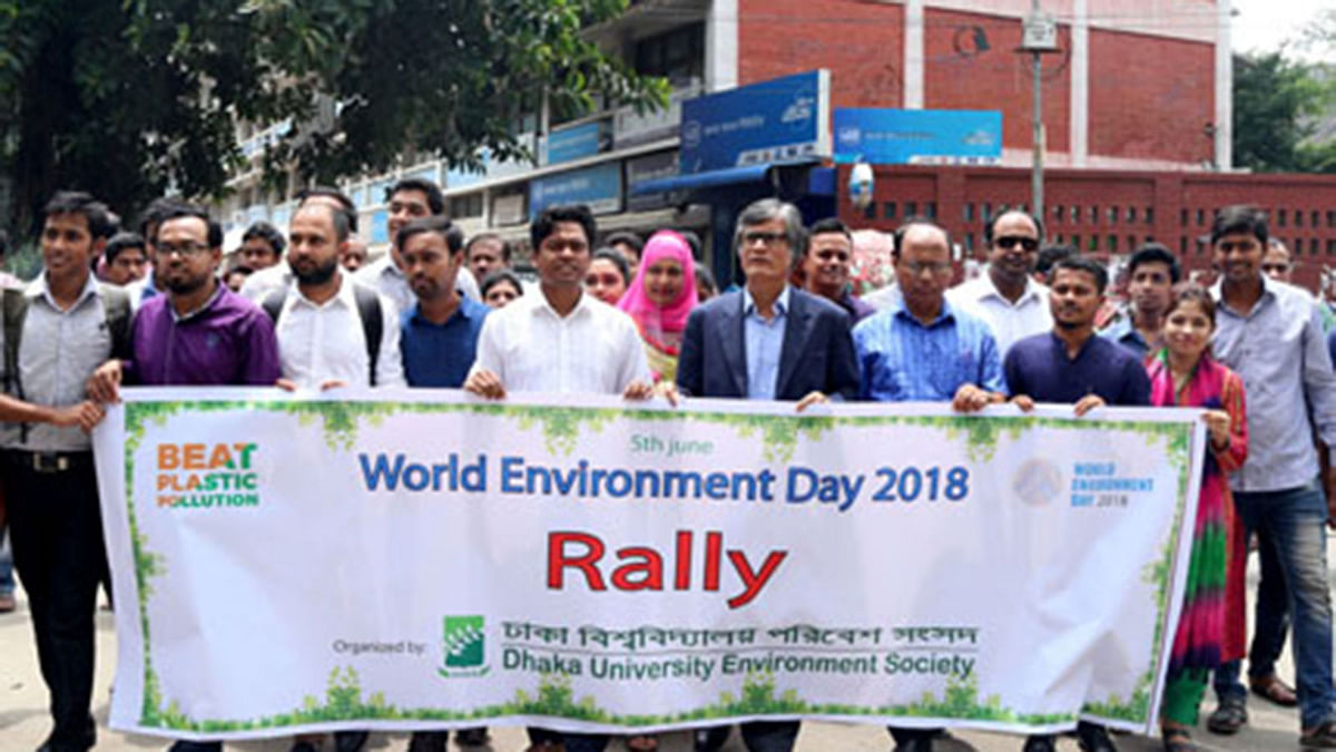 Dhaka University Environment Society brings out a colourful rally on Dhaka University campus on Tuesday. Photo: BSS