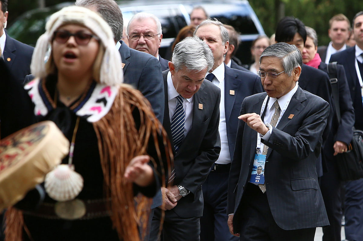 Governor of the Bank of Japan Haruhiko Kuroda (R) speaks with chair of the Federal Reserve Jerome Powell while arriving at the welcome reception dinner during the G7 Finance Ministers Summit in Whistler, British Columbia, Canada, 31 May 2018. Photo: Reuters