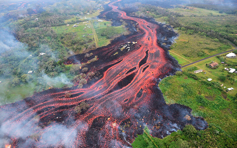 In this 19 May 2018, file photo released by the US Geological Survey, lava flows from fissures near Pahoa, Hawaii. Technically speaking, Kilauea has been continuously erupting since 1983. Photo: AP