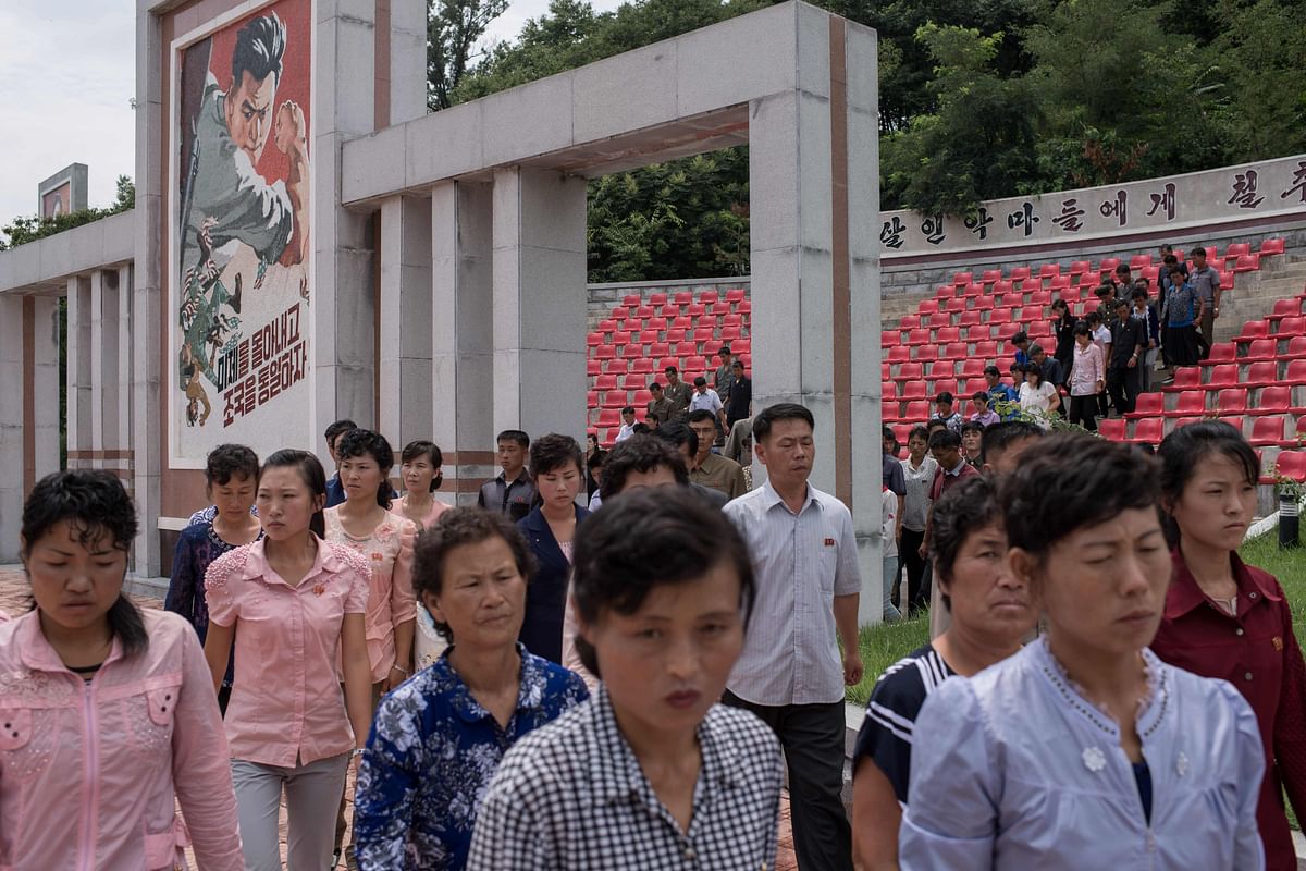 In a file photo taken on 24 July 2017 North Korean visitors leave a `revenge pledging place` after visiting the Sinchon Museum of American War Atrocities in Sinchon, south of Pyongyang. Photo: AFP