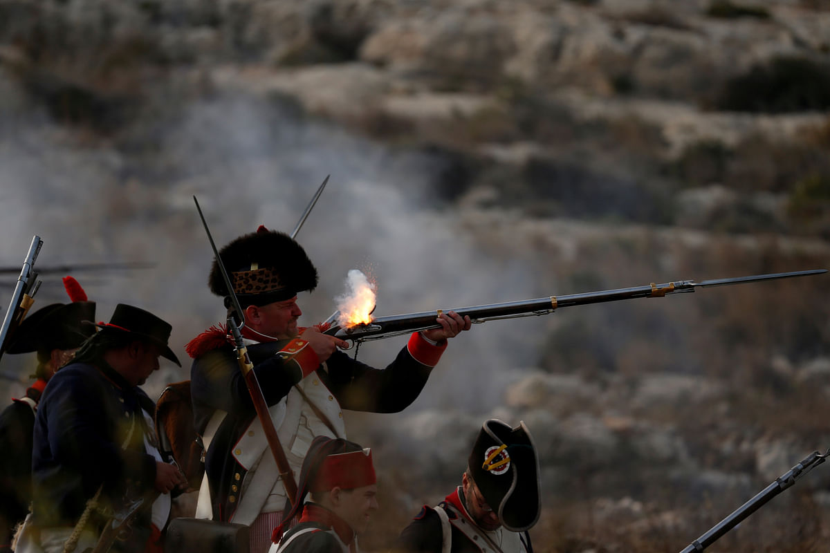 Napoleonic French re-enactors fire on Maltese defence positions during a re-enactment of the French invasion of Malta in 1798, at Mistra Bay outside Mellieha, Malta on 6 June 2018. Photo: Reuters