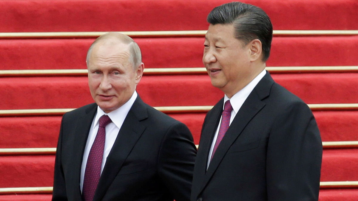 Chinese president Xi Jinping and Russian president Vladimir Putin attend a welcome ceremony outside the Great Hall of the People in Beijing, China on 8 June 2018. Photo: Reuters