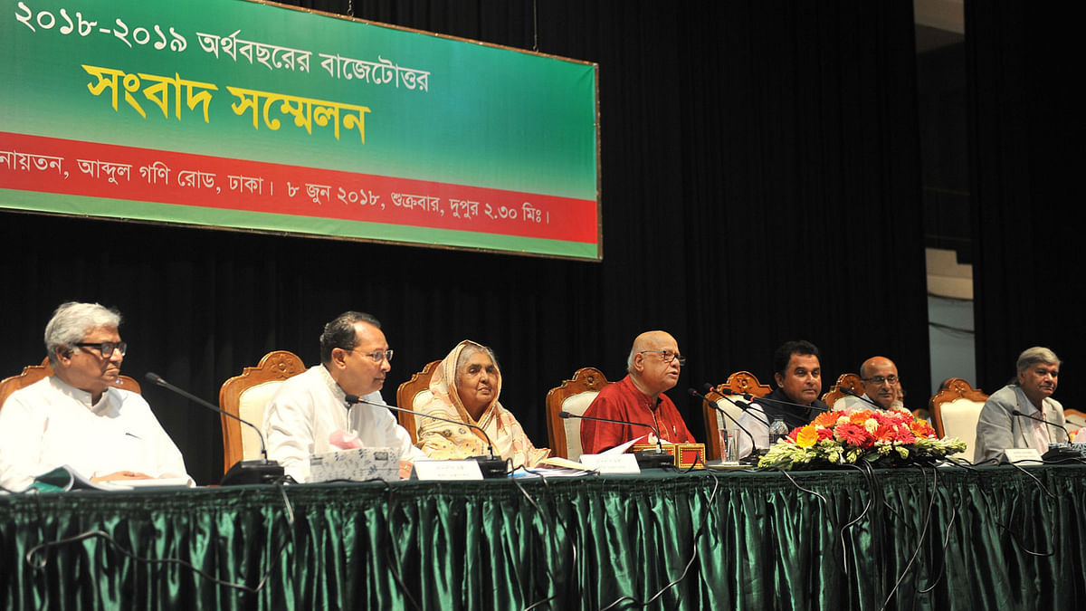 Finance minister AMA Muhith addressing a post-budget press conference at Osmani Memorial auditorium in Dhaka on Friday. Photo: PID