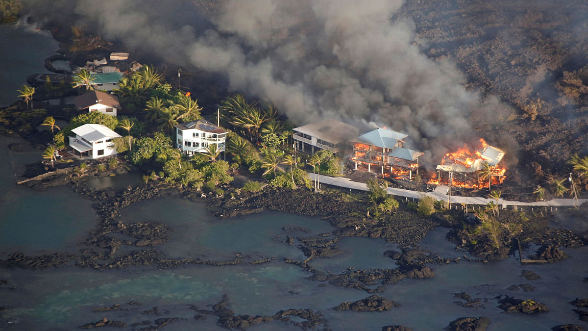 Lava destroys homes in the Kapoho area, east of Pahoa, during ongoing eruptions of the Kilauea Volcano in Hawaii, US, on 5 June 2018. Photo: Reuters