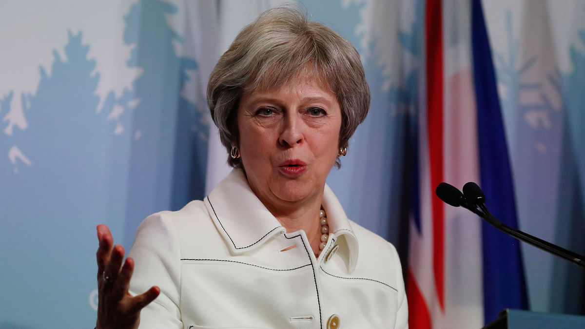 Britain`s prime minister Theresa May addresses the final news conference of the G7 summit in the Charlevoix city of La Malbaie. Photo: Reuters