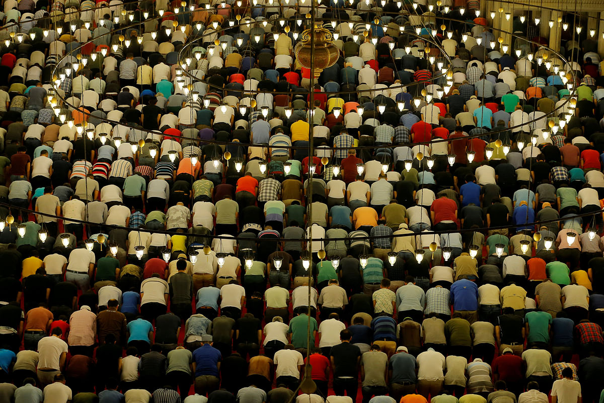 Muslims take part in evening prayers called `Tarawih` on Laylat al-Qadr or Night of Decree, at Suleymaniye mosque during the holy month of Ramadan in Istanbul, Turkey on 10 June. Photo: Reuters