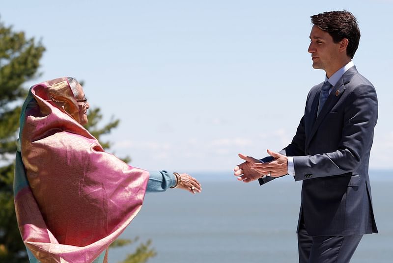 Canada`s prime minister Justin Trudeau greets Bangladesh`s prime minister Sheikh Hasina as she arrives for the official welcoming ceremony for outreach countries and international Organisations at the G7 Summit in the Charlevoix town of La Malbaie, Quebec, Canada, 9 June, 2018. Photo: Reuters