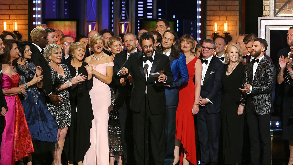Playwright Tony Kushner, centre, and the cast and crew of `Angels in America` accept the award for best revival of a play at the 72nd annual Tony Awards at Radio City Music Hall on Sunday, 10 June 2018 in New York. Photo: AP