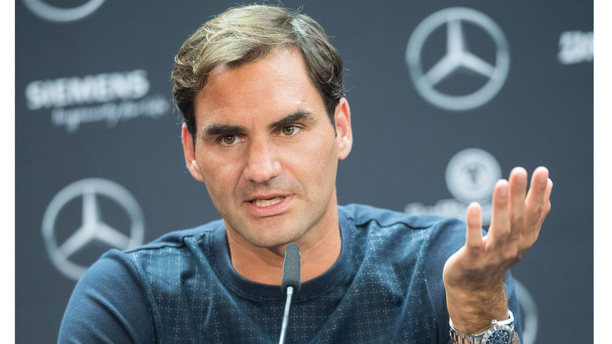Switzerland`s Roger Federer attends a press conference in Stuttgart prior the ATP Cup tennis tournament on 11 June. Photo: AFP.