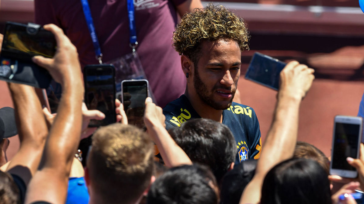 Fans take photographs of Brazil`s Neymar after a training session at Sochi Municipal Stadium in Sochi on 12 June, 2018, ahead of the Russia 2018 World Cup football tournament. Photo: AFP