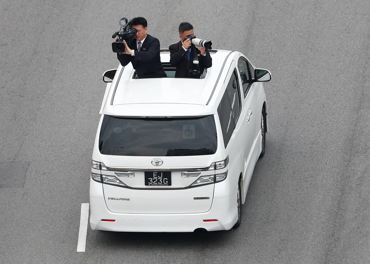 Official cameramen follow the motorcade of North Korean leader Kim Jong Un travels towards Sentosa for his meeting with US president Donald Trump, in Singapore on 12 June. Photo: Reuters