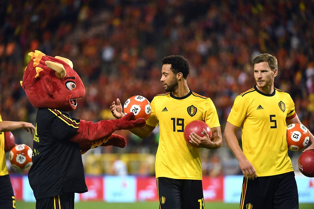 Belgium`s midfielder Moussa Dembele (C) celebrates with the Red Devil Mascott at the end of the international friendly football match between Belgium and Costa Rica at the King Baudouin Stadium in Brussels on 11 June 2018. Photo: AFP