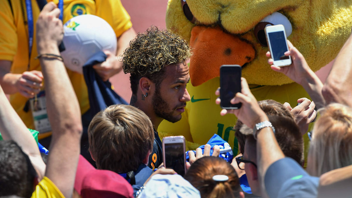 Fans take photographs of Brazil`s Neymar after a training session at Sochi Municipal Stadium in Sochi on 12 June, 2018, ahead of the Russia 2018 World Cup football tournament. Photo: AFP