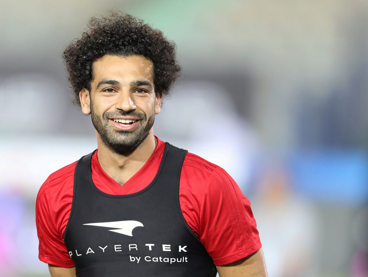 Egypt`s Mohamed Salah smiles next to his teammates in Cairo international stadium in Cairo. Photo: Reuters