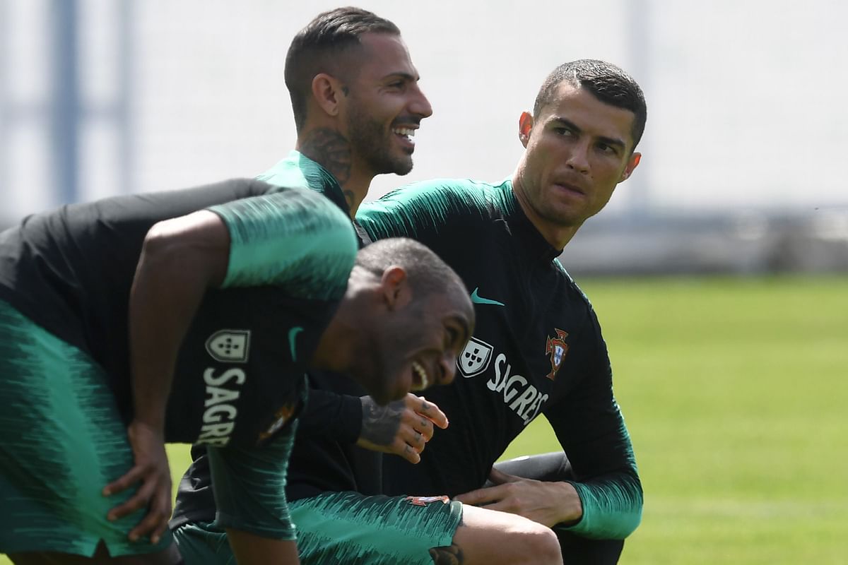 Portugal forwards Cristiano Ronaldo (R) and Ricardo Quaresma and defender Ricardo Pereira (L) attend a training session at their base camp in Kratovo, on the outskirts of Moscow, on Tuesday. AFP