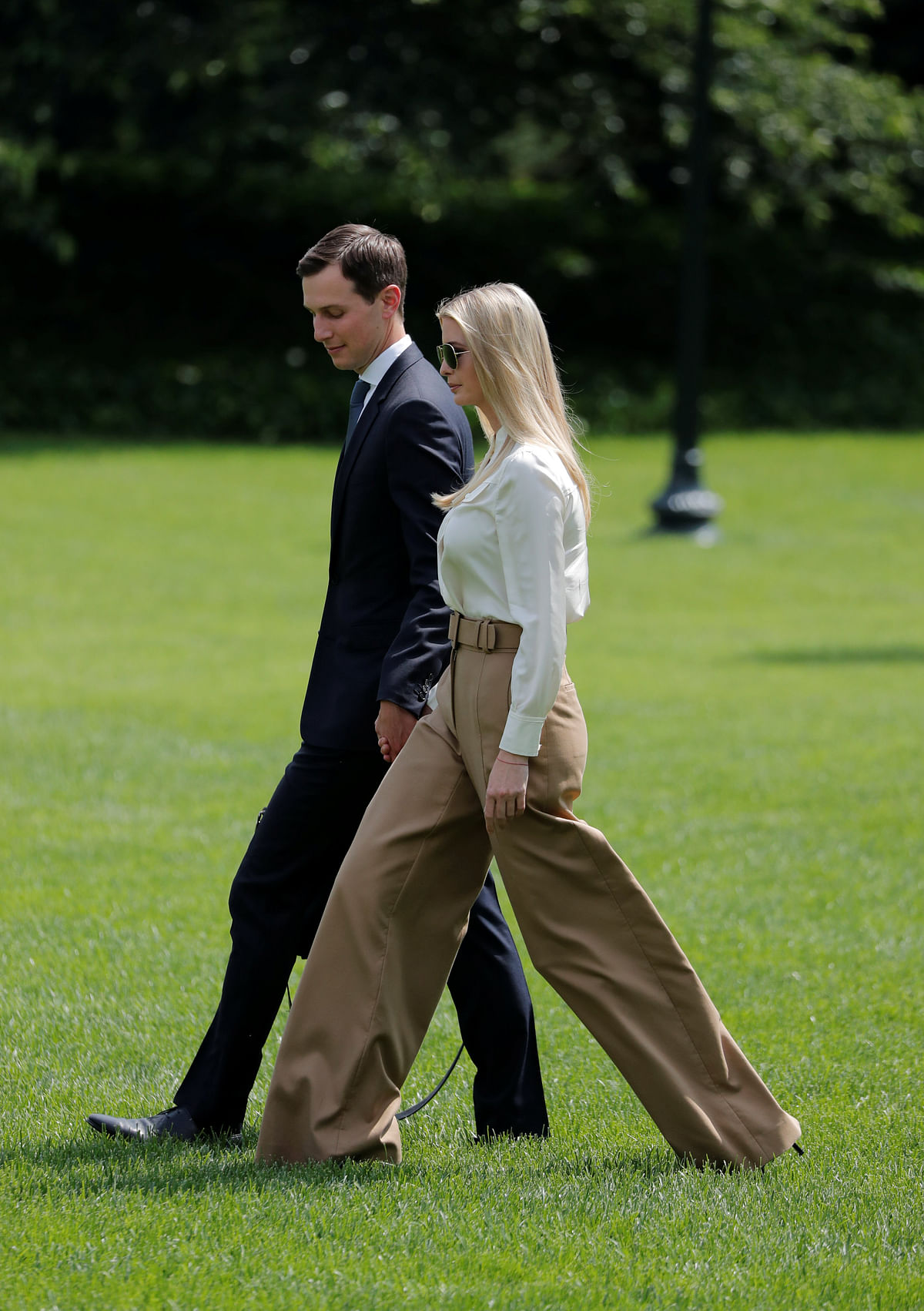 White House senior advisers Jared Kushner and wife Ivanka Trump walk on the South Lawn of the White House as US president Donald Trump departed Washington for the Camp David presidential retreat in Maryland, US on 1 June 2018. Photo: Reuters
