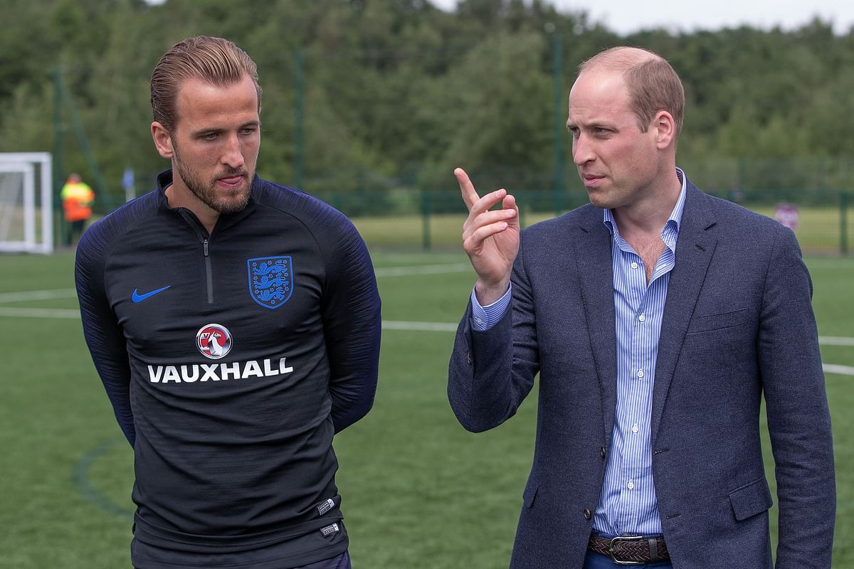 Prince William speaks with England striker Harry Kane at the team`s training base at the West Riding County Football Association, south of Leeds, in northern England on June 7. AFP