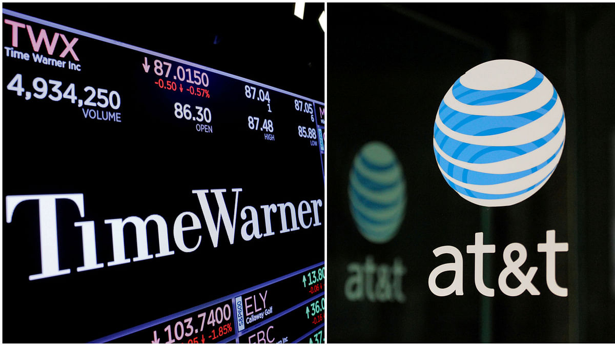 A combination photo shows the Time Warner shares price at the New York Stock Exchange and AT&T logo in New York, NY, US on 15 November  2017 and on 23 October 2016 respectively. Photo: Reuters