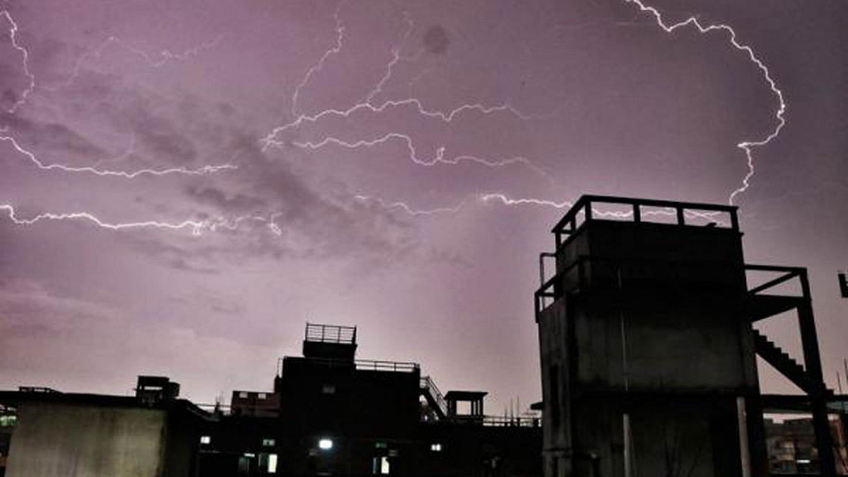 Thunderbolts are seen in the sky of Shankhari Bazaar area of Old Dhaka in the capital on 12 June. Photo: Dipu Malakar