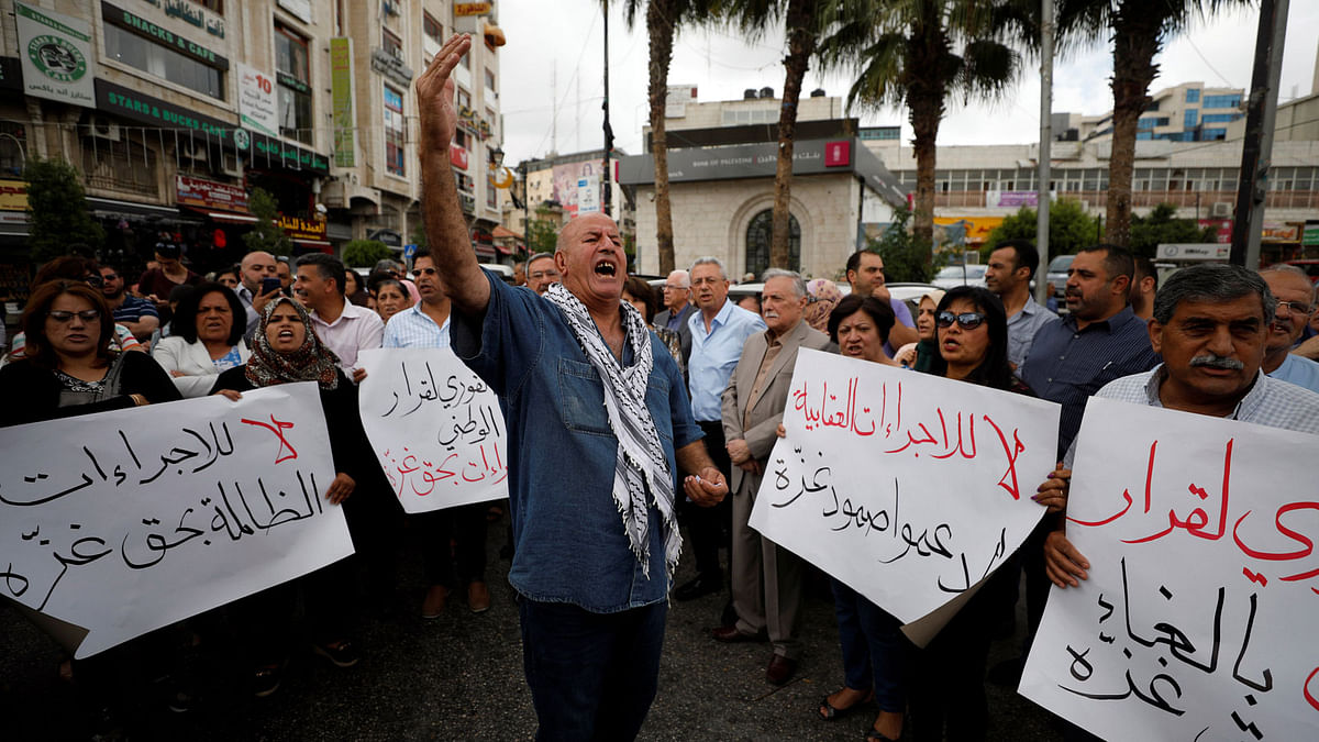 Palestinians take part in a protest demanding to lift the sanctions on Gaza Strip, in Ramallah, in the occupied West Bank, on 12 June 2018. Photo: Reuters