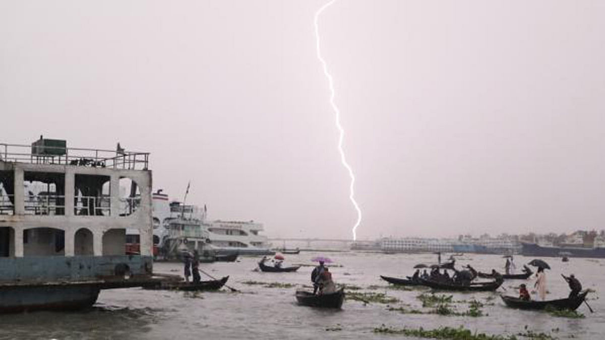 People cross the river of Buriganga despite risks in a stormy weather in Sadarghat. The photo was taken from Sadarghat launch terminal area in Dhaka on 12 June 2018 by Dipu Malakar