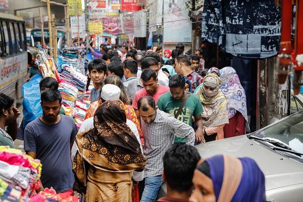 Pedestrians suffer as hawkers set their makeshift shops on the footpath in Malibagh, Dhaka on 11 June. Photo: Dipu Malakar