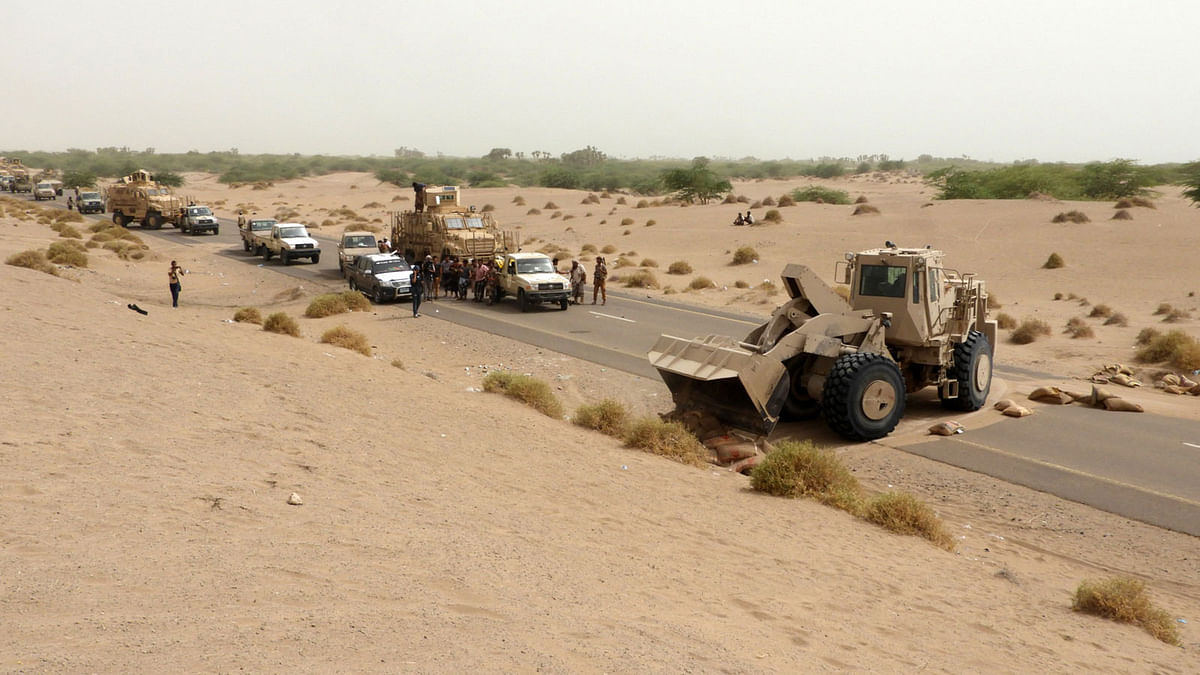 A bulldozer clears the way for a column of Yemeni pro-government forces arriving in al-Durayhimi district, about nine kilometres south of Hodeidah international airport on 13 June 2018. Photo: AFP
