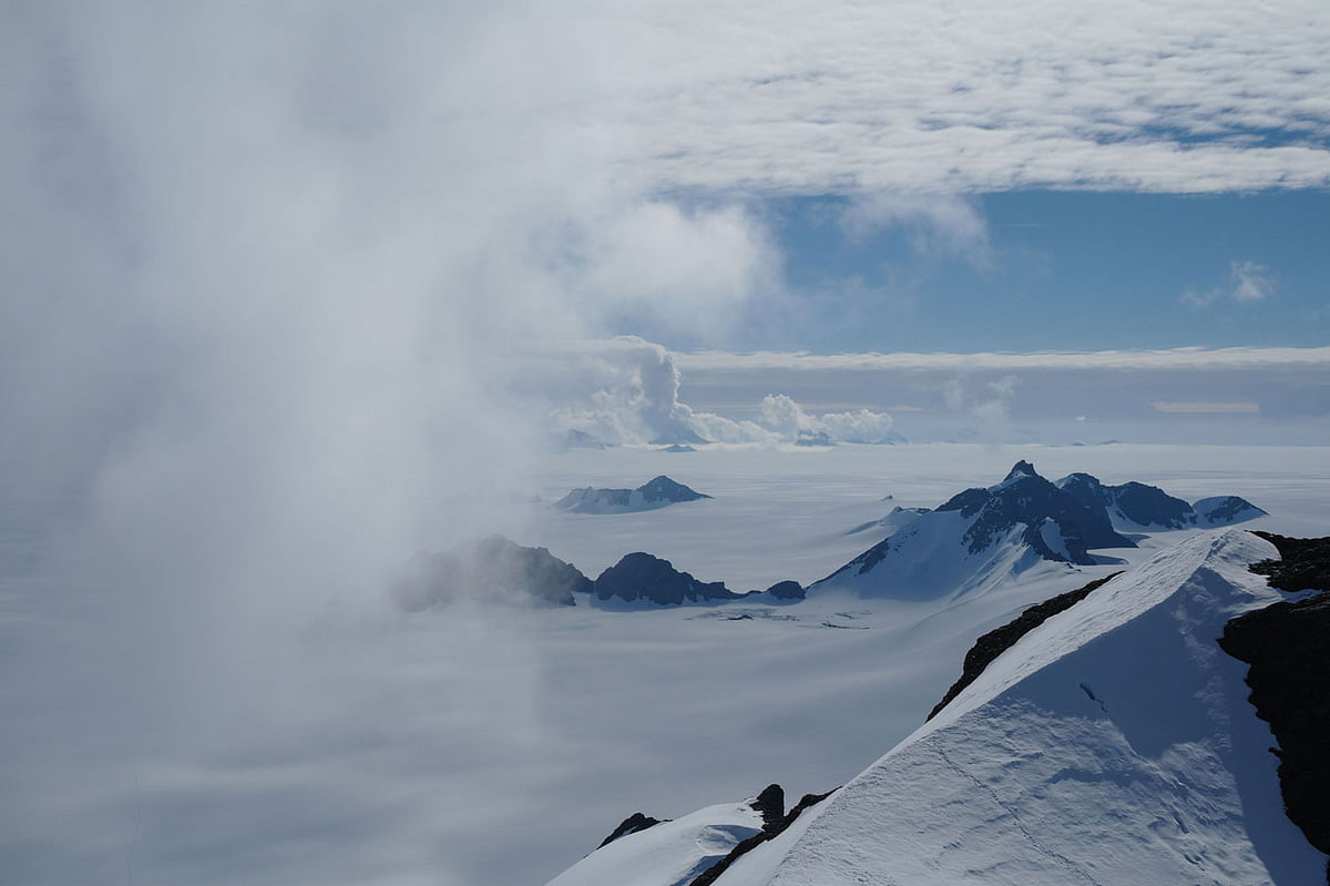 Hand-out photo taken on 8 January 2011 and received on 12 June 2018 via the Nature website shows summer clouds swirling in around the Staccato Peaks of Alexander Island, Antarctic Peninsula. Antarctica has lost a staggering three trillion tonnes of ice since 1992, according to a landmark study published on 13 June 2018. Photo: AFP