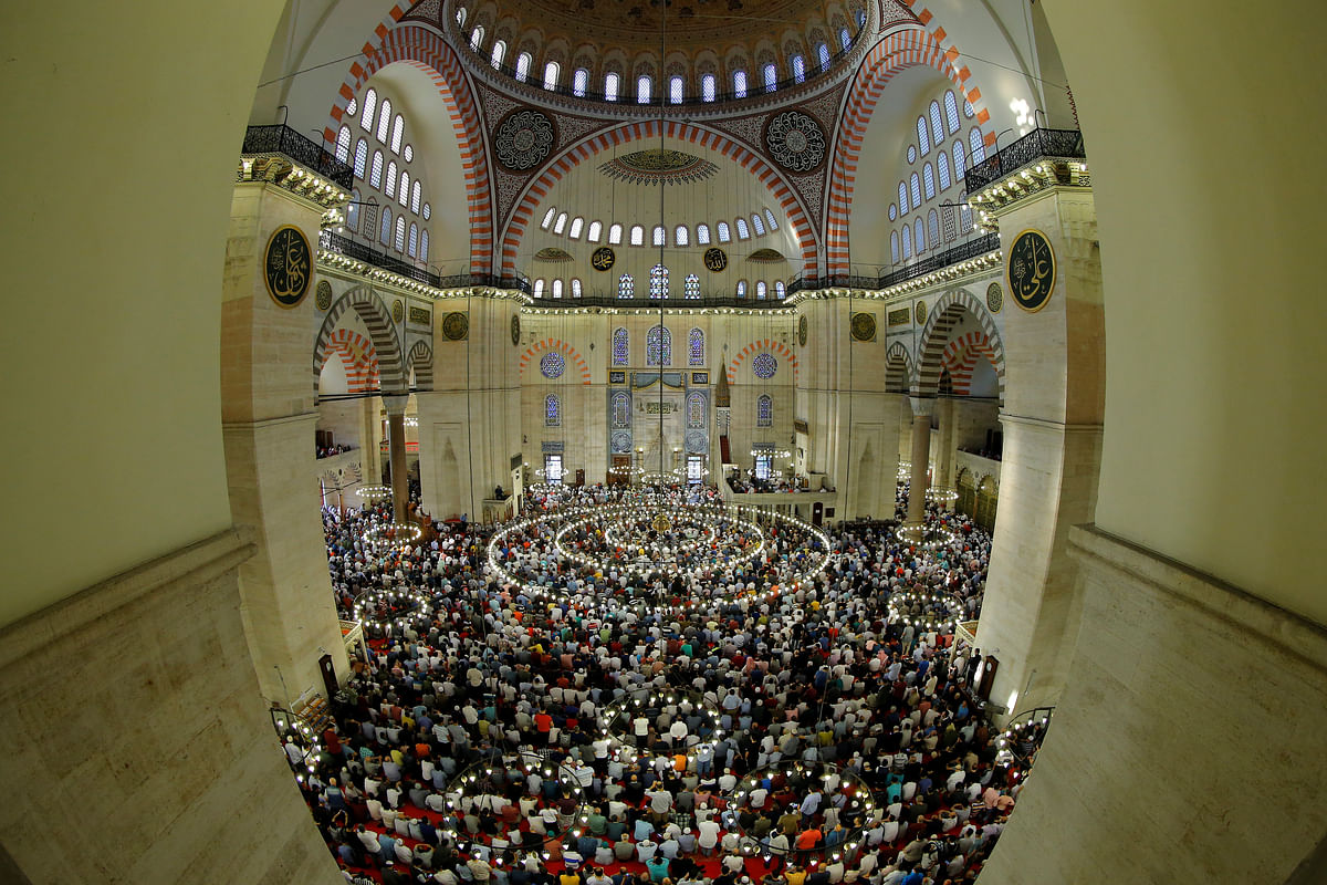 Worshippers pray during the first day celebration of Eid al Fitr at Suleymaniye Mosque in Istanbul, Turkey. Photo: Reuters