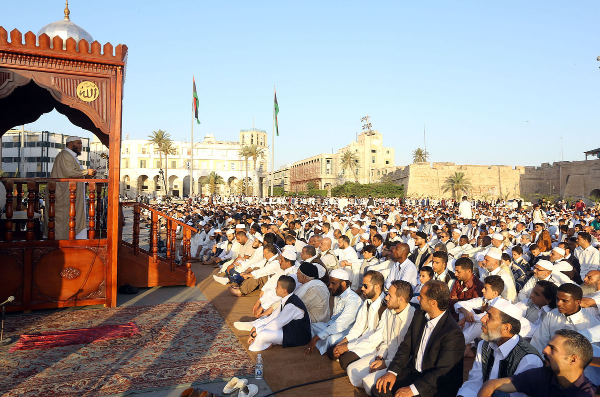 Libyan Muslim worshipers perform Eid al-Fitr prayers at the Martyrs` Square in the capital Tripoli Photo: AFP
